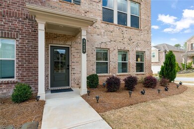 Doorway to property featuring brick siding