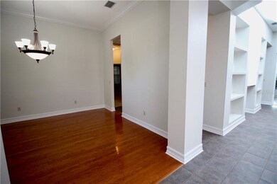 DINING ROOM WITH MAPLE WOOD FLOORING, CROWN MOLDIN