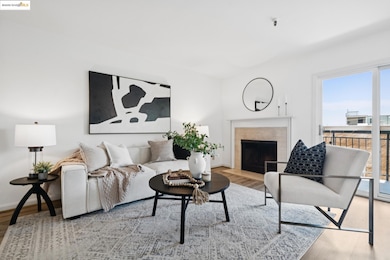Living room with healthy amount of natural light, wood finished floors, and a fireplace