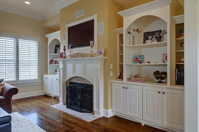 Beautiful built in book shelves, and plantation shutters in the living space. Snuggle up to watch a movie on the surround sound with the built in speakers, TV nook, and cozy fire gas fireplace.