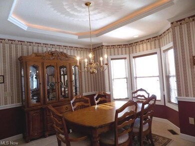 This elegant dining room features crown molding an