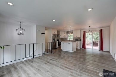 Looking at the kitchen and the dining area from the living room