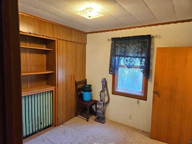 Carpeted empty room with ornamental molding