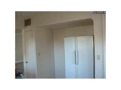 Recessed space for stove and refrigerator.