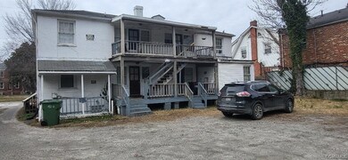 View of front of house with a porch and a balcony