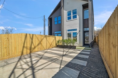 This fully-gated front courtyard features a double