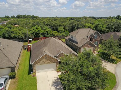 This home has so much to offer - inside and out!  Gorgeous stone fascia, brick on 4 sides, double wide driveway, and NO BACK NEIGHBORS!  Inside find beautiful wood laminate & ceramic tile floors in all living areas, a formal dining room, spacious family room with a gas log fireplace, SS appliances, and much more!
