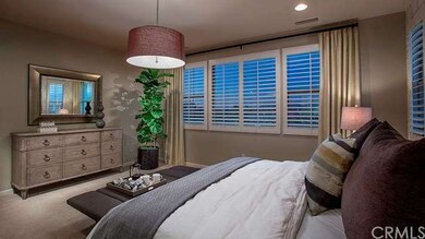 Spacious master bedroom. Photo is of model home no
