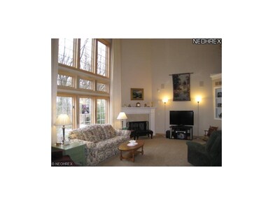 2 story great room with wall of windows.