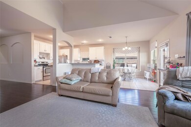 Living room with an inviting chandelier and light 