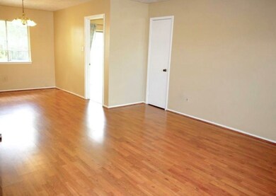 You will find an entrance with coat closet, not pictured, that leads to this spacious open concept dining and living space. Take note that the floors throughout the house were just upgraded with beautiful laminate wood floors for style and easy care.