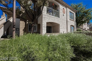 Back of house featuring a balcony and stucco sidin