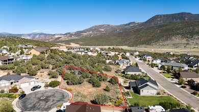 Aerial perspective of suburban area featuring property boundaries highlighted