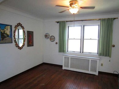 Dining Room. Exposed Hardwood Flooring is featured