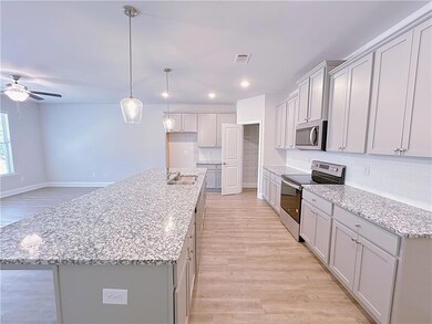 Kitchen featuring appliances with stainless steel 