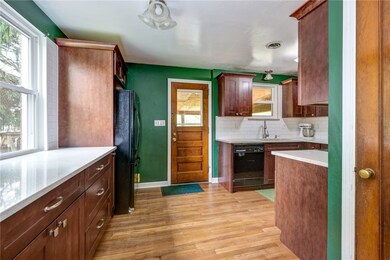 The recently renovated kitchen features plenty of beautiful quartz countertops as well as ample storage in the gorgeous wood cabinetry.