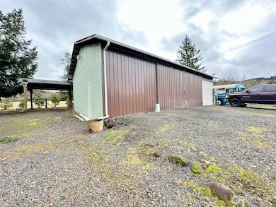 Large shop with tall entry for RV, log truck or camper storage.