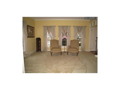 Formal living room with crown molding