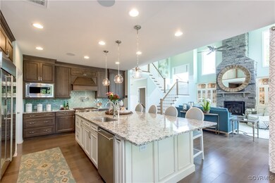 Kitchen featuring sink, built in appliances, dark
