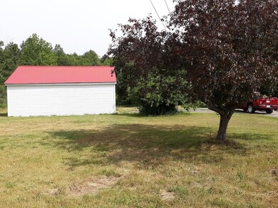 21 Newton Drive garage side and mature f