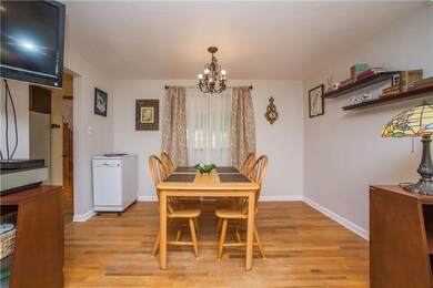 Dining room has hardwood flooring and has access t