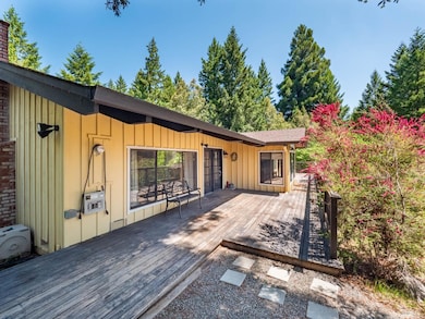 The deck on the front of the home is partially covered and extends the length of the home.  The converter allows for generator backup in the case of a power outage.