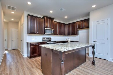 Kitchen with light hardwood / wood-style flooring,