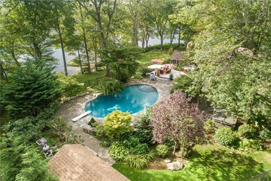 View of gunite heated pool, deck, lake, dock and t