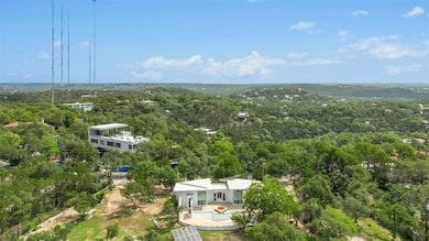 View from above of property with a forest