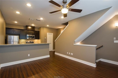 Kitchen featuring stainless steel appliances, base