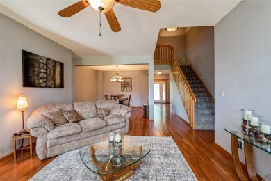 Living Room - Notice the Open Staircase and Tall C