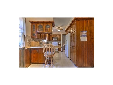 Kitchen has breakfast bar for additional eating an