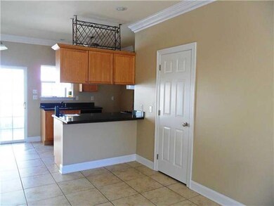 Kitchen. Half bath to the right with granite and r