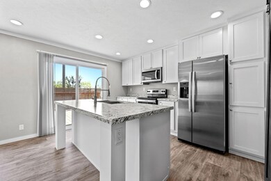 Kitchen featuring sink, wood-type flooring, a cent