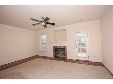 Beautiful fireplace with marble surround and hardw