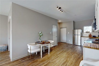 Kitchen featuring stainless steel appliances, whit