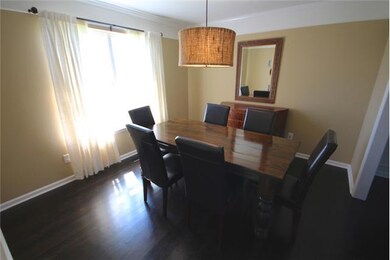 Formal Dining Room with Hardwood Flooring and Two Piece Crown Molding