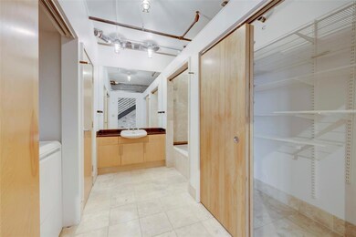 Bathroom featuring vanity, tub / shower combinati