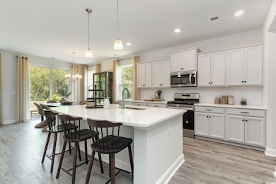 Kitchen featuring stainless steel appliances, whit