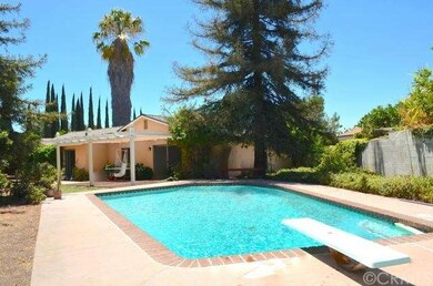 Refreshing pool with oversized lot and inviting pa