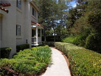 Walk way to front entry.   End unit makes for grea