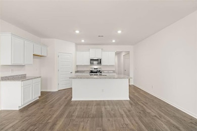 Kitchen featuring appliances with stainless steel 