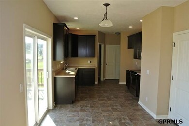breakfast nook overlooks large deck with views of Waterford's lake.