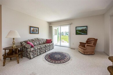 The living room has sliders to a patio.