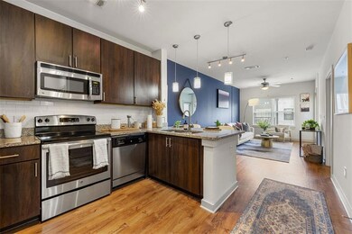 Kitchen with stainless steel appliances, sink, kit
