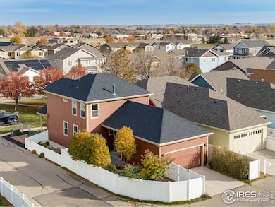 Easy Alley load 2 car garage - fully fenced with low maintenance vinyl + irrigation lines to the garden both behind  + the beds to the north/side additional side patio.