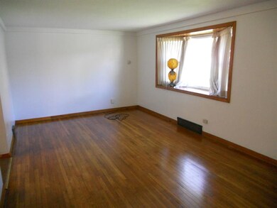 Living Room with Bay window and hardwood floors