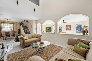Living room featuring ceiling fan