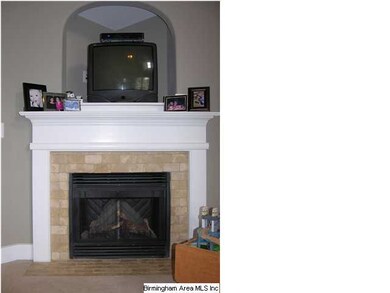 Electric fireplace with TV above in main living ar