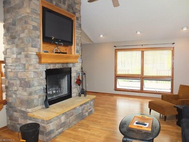 Floor to ceiling stone fireplace in great room.